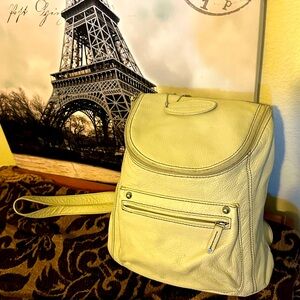 Vintage Pelle leather backpack off white in color with 2 call out pictures